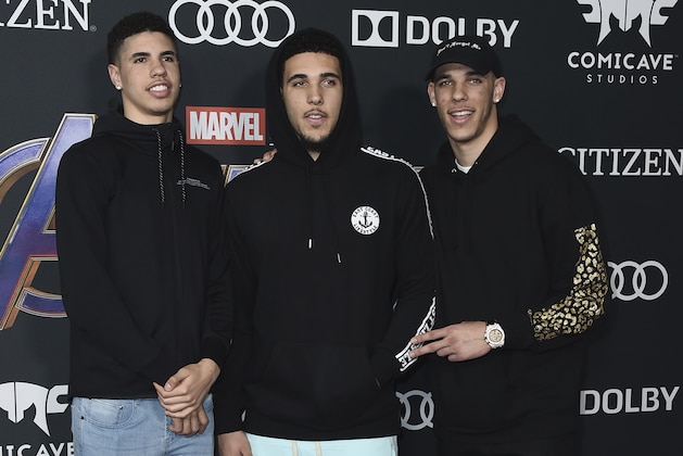 Professional basketball player Lonzo Ball, of the Los Angeles Lakers, from right, and his brothers LiAngelo Ball and LaMelo Ball arrive at the premiere of
