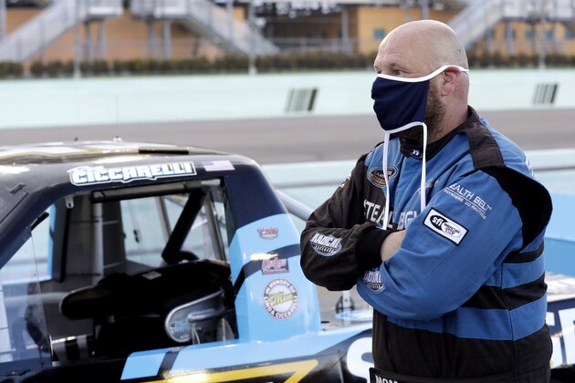 Ray Ciccarelli waits for the start of a NASCAR Truck Series auto race Saturday, June 13, 2020, in Homestead, Fla. Ciccarelli has announced he's quitting NASCAR because of their decision to ban the Confederate flag from its events. (AP Photo/Wilfredo Lee) Ray Ciccarelli waits for the start of a NASCAR Truck Series auto race Saturday, June 13, 2020, in Homestead, Fla. Ciccarelli has announced he's quitting NASCAR because of their decision to ban the Confederate flag from its events. (AP Photo/Wilfredo Lee)