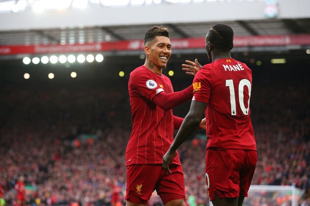LIVERPOOL, ENGLAND - MARCH 07:  Sadio Mane of Liverpool celebrates with Roberto Firmino after scoring their second goal during the Premier League match between Liverpool FC and AFC Bournemouth  at Anfield on March 07, 2020 in Liverpool, United Kingdom. (Photo by Alex Livesey - Danehouse/Getty Images )