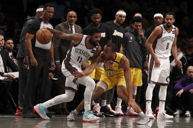 NEW YORK, NEW YORK - JANUARY 23:  (NEW YORK DAILIES OUT)   Kyrie Irving #11 of the Brooklyn Nets in action against Avery Bradley #11 of the Los Angeles Lakers at Barclays Center on January 23, 2020 in New York City. The Lakers defeated the Nets 128-113. NOTE TO USER: User expressly acknowledges and agrees that, by downloading and or using this photograph, User is consenting to the terms and conditions of the Getty Images License Agreement. (Photo by Jim McIsaac/Getty Images)
