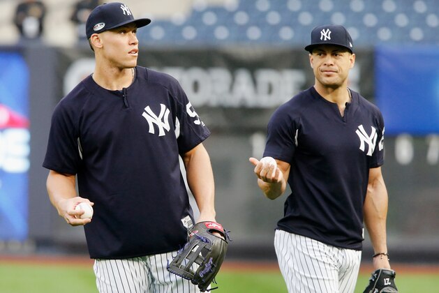 NEW YORK, NY - OCTOBER 08:  (NEW YORK DAILIES OUT)   Aaron Judge #99 and Giancarlo Stanton #27 of the New York Yankees during batting practice against the Boston Red Sox before Game Three of the American League Division Series at Yankee Stadium on October 8, 2018 in the Bronx borough of New York City. The Red Sox defeated the Yankees  16-1.  (Photo by Jim McIsaac/Getty Images)