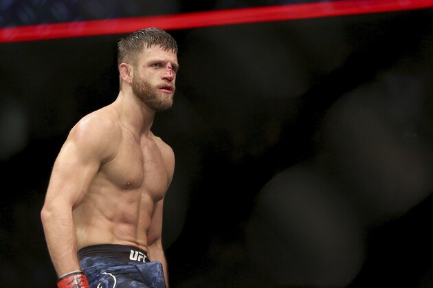 Calvin Kattar celebrates a win over Shane Burgos during a mixed martial arts bout at UFC 220, Saturday, January 20, 2018, in Boston. Kattar won via third-round TKO. (AP Photo/Gregory Payan)