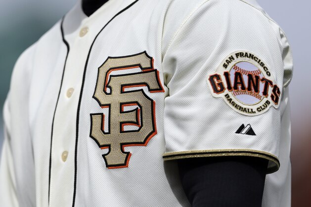 A Gold team logo is seen on the chest of San Francisco Giants first base coach Roberto Kelly during a baseball game against the St. Louis Cardinals on Sunday, April 7, 2013, in San Francisco. (AP Photo/Marcio Jose Sanchez) A Gold team logo is seen on the chest of San Francisco Giants first base coach Roberto Kelly during a baseball game against the St. Louis Cardinals on Sunday, April 7, 2013, in San Francisco. (AP Photo/Marcio Jose Sanchez)