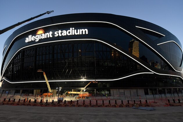 LAS VEGAS, NEVADA - APRIL 23:  Crews test out architectural light ribbons and exterior sign lighting as construction continues at Allegiant Stadium, the USD 2 billion, glass-domed future home of the Las Vegas Raiders on April 23, 2020 in Las Vegas, Nevada. The Raiders and the UNLV Rebels football teams are scheduled to begin play at the 65,000-seat facility in their 2020 seasons.  (Photo by Ethan Miller/Getty Images)