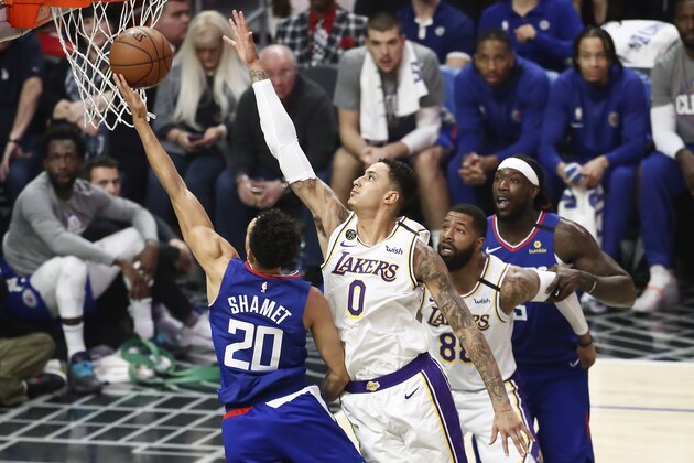 LOS ANGELES, CA - MARCH 8: Landry Shamet #20 of the LA Clippers shoots the ball against Kyle Kuzma #0 of the Los Angeles Lakers during a game at the Staples Center on March 8, 2020 in Los Angeles, CA. NOTE TO USER: User expressly acknowledges and agrees that, by downloading and or using this photograph, User is consenting to the terms and conditions of the Getty Images License Agreement. Mandatory Credit: 2020 NBAE (Photo by Chris Elise/NBAE via Getty Images) LOS ANGELES, CA - MARCH 8: Landry Shamet #20 of the LA Clippers shoots the ball against Kyle Kuzma #0 of the Los Angeles Lakers during a game at the Staples Center on March 8, 2020 in Los Angeles, CA. NOTE TO USER: User expressly acknowledges and agrees that, by downloading and or using this photograph, User is consenting to the terms and conditions of the Getty Images License Agreement. Mandatory Credit: 2020 NBAE (Photo by Chris Elise/NBAE via Getty Images)