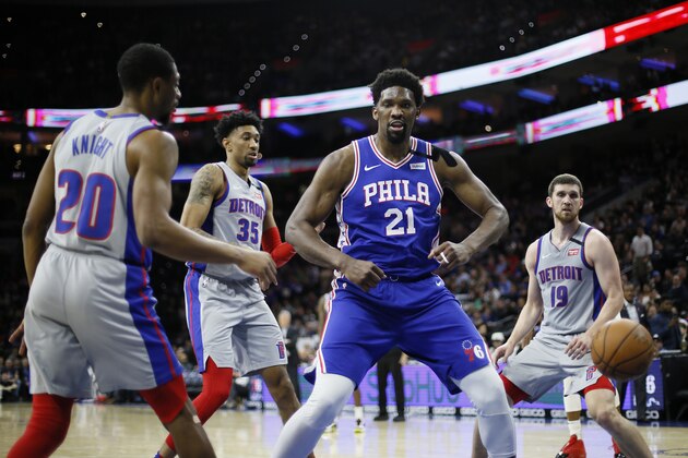 Philadelphia 76ers' Joel Embiid (21) reacts after a dunk during the second half of an NBA basketball game against the Detroit Pistons, Wednesday, March 11, 2020, in Philadelphia. (AP Photo/Matt Slocum)