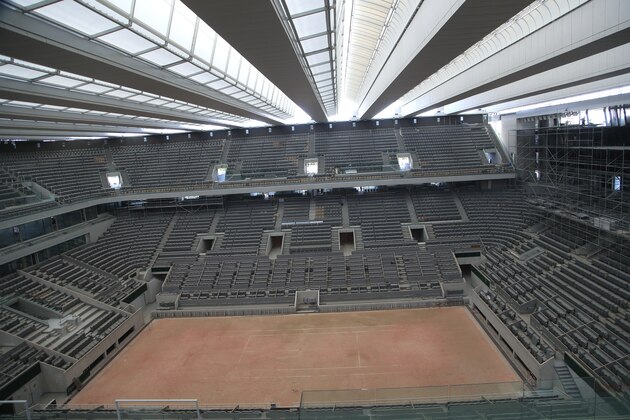 A general view of the Philippe-Chatrier tennis court with its new retractable roof during a media tour at Roland Garros stadium in Paris, Wednesday, May 27, 2020. The French open will moving to September from the end of May because of the outbreak of the COVID-19 disease. (AP Photo/Michel Euler)
