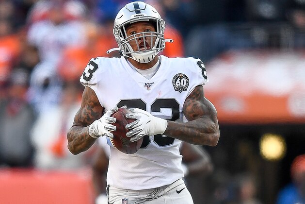 DENVER, CO - DECEMBER 29:  Darren Waller #83 of the Oakland Raiders runs after a catch for a 79 yard gain in the first quarter of a game against the Denver Broncos at Empower Field at Mile High on December 29, 2019 in Denver, Colorado.  (Photo by Dustin Bradford/Getty Images)