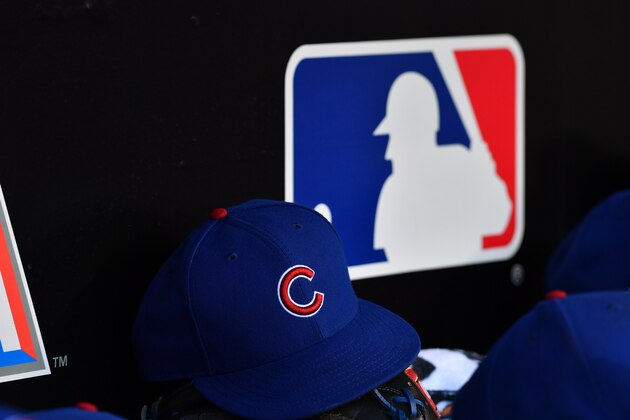MIAMI, FL - APRIL 01: A detailed view of the New Era ball cap and MLB logo in the dugout of the Chicago Cubs against the Miami Marlins at Marlins Park on April 1, 2018 in Miami, Florida. (Photo by B51/Mark Brown/Getty Images) *** Local Caption ***