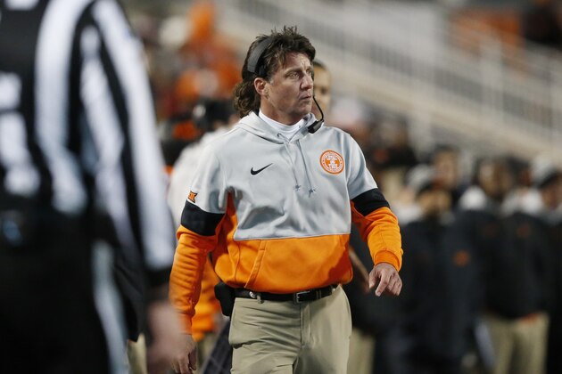 In this Nov. 30, 2019 file photo Oklahoma State head coach Mike Gundy walks on the sidelines during an NCAA college football game against Oklahoma in Stillwater, Okla. Gundy said Tuesday, April 7, 2020 he hopes to have his team return to its facilities on May 1, a proposed timetable that would defy federal social-distancing guidelines and was quickly disputed by the university and its athletic director. (AP Photo/Sue Ogrocki)