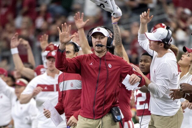 Oklahoma head coach Lincoln Riley cheers with his players and coaches during the first half of an NCAA college football game against Baylor for the Big 12 Conference championship, Saturday, Dec. 7, 2019, in Arlington, Texas. (AP Photo/Jeffrey McWhorter) Oklahoma head coach Lincoln Riley cheers with his players and coaches during the first half of an NCAA college football game against Baylor for the Big 12 Conference championship, Saturday, Dec. 7, 2019, in Arlington, Texas. (AP Photo/Jeffrey McWhorter)