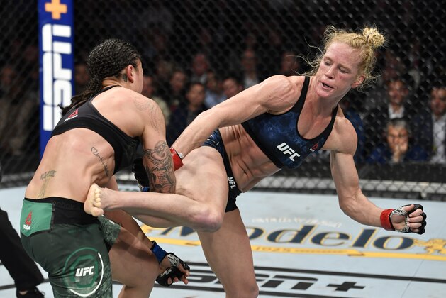 LAS VEGAS, NEVADA - JANUARY 18: (R-L) Holly Holm kicks Raquel Pennington in their bantamweight fight during the UFC 246 event at T-Mobile Arena on January 18, 2020 in Las Vegas, Nevada. (Photo by Jeff Bottari/Zuffa LLC via Getty Images)