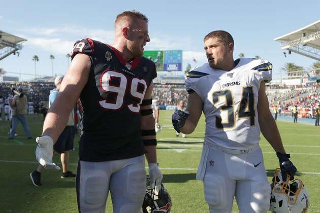 CARSON, CALIFORNIA - SEPTEMBER 22: J.J. Watt #99 of the Houston Texans and brother Derek Watt #34 of the Los Angeles Chargers walk off the field following the Texans 27-20 victory over the Chargers at Dignity Health Sports Park on September 22, 2019 in Carson, California. (Photo by Jeff Gross/Getty Images)