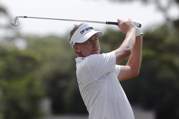 Ian Poulter of England, watches his shot from the 17th tee, during the first round of the RBC Heritage golf tournament, Thursday, June 18, 2020, in Hilton Head Island, S.C. (AP Photo/Gerry Broome)