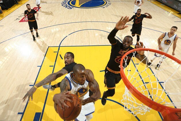 OAKLAND, CA - JUNE 19:  Andre Iguodala #9 of the Golden State Warriors goes to the basket against J.R. Smith #5 of the Cleveland Cavaliers in Game Seven of the 2016 NBA Finals on June 19, 2016 at Oracle Arena in Oakland, California. NOTE TO USER: User expressly acknowledges and agrees that, by downloading and or using this photograph, user is consenting to the terms and conditions of Getty Images License Agreement. Mandatory Copyright Notice: Copyright 2016 NBAE (Photo by Nathaniel S. Butler/NBAE via Getty Images)