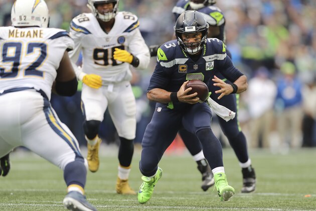 Seattle Seahawks quarterback Russell Wilson (3) scrambles for a first down in the second half of an NFL football game, Sunday, Oct. 28, 2018, in Los Angeles. (AP Photo/Peter Joneleit)