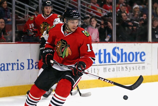 CHICAGO, IL - FEBRUARY 22: Daniel Carcillo #13 of the Chicago Blackhawks chases the puck against the Boston Bruins at the United Center on February 22, 2015 in Chicago, Illinois. The Bruins defeated the Blackhawks 6-2. (Photo by Jonathan Daniel/Getty Images)