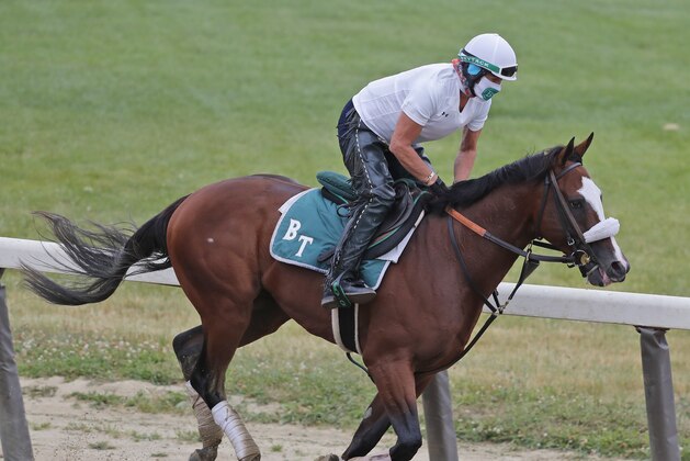 Robin Smullen rides Belmont Stakes favorite Tiz the Law during a workout at Belmont Park in Elmont, N.Y., Thursday, June 18, 2020.(AP Photo/Seth Wenig)