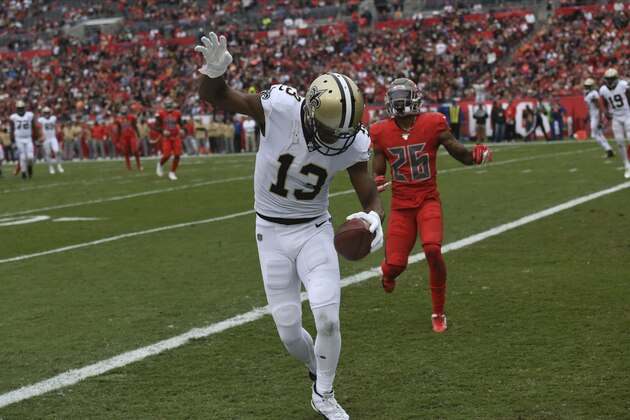 New Orleans Saints wide receiver Michael Thomas (13) scores in front of Tampa Bay Buccaneers defensive back Sean Murphy-Bunting (26) during the first half of an NFL football game Sunday, Nov. 17, 2019, in Tampa, Fla. (AP Photo/Jason Behnken)