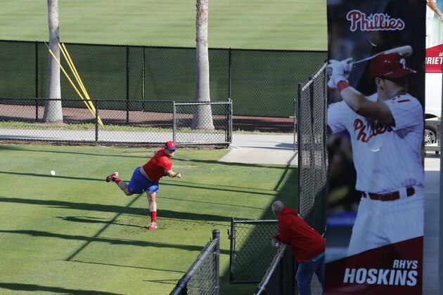 Philadelphia Phillies pitcher Robert Stock throws, Friday, March 13, 2020, in Clearwater, Fla. Major League Baseball has delayed the start of its season by at least two weeks because of the coronavirus outbreak and suspended the rest of its spring training schedule. (AP Photo/Carlos Osorio)