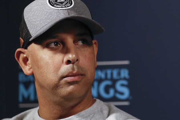 FILE - In this Dec. 9, 2019, file photo, Boston Red Sox manager Alex Cora listens to a question during the Major League Baseball winter meetings, in San Diego. Houston  manager AJ Hinch and general manager Jeff Luhnow were suspended for the entire season Monday, Jan. 13, 2020,  and the team was fined $5 million for sign-stealing by the team in 2017 and 2018 season. Commissioner Rob Manfred announced the discipline and strongly hinted that current Boston manager Alex Cora — the Astros bench coach in 2017 — will face punishment later. Manfred said Cora developed the sign-stealing system used by the Astros. (AP Photo/Gregory Bull, File)