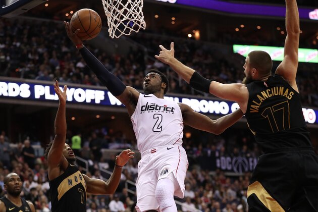 WASHINGTON, DC - APRIL 27: John Wall #2 of the Washington Wizards shoots in front of Jonas Valanciunas #17 of the Toronto Raptors in the second half during Game Six of Round One of the 2018 NBA Playoffs at Capital One Arena on April 27, 2018 in Washington, DC. NOTE TO USER: User expressly acknowledges and agrees that, by downloading and or using this photograph, User is consenting to the terms and conditions of the Getty Images License Agreement. (Photo by Patrick Smith/Getty Images)