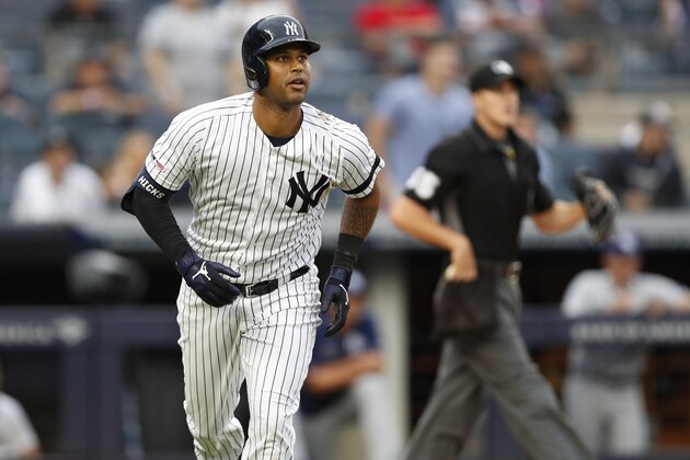New York Yankees' Aaron Hicks watches his solo home run during the sixth inning of the first game of a baseball doubleheader against the Tampa Bay Rays, Thursday, July 18, 2019, in New York. (AP Photo/Kathy Willens)