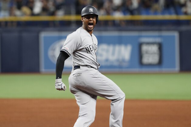 New York Yankees' Aaron Hicks celebrates home run agains the Tampa Bay Rays during the ninth inning of a baseball game Saturday, July 6, 2019, in St. Petersburg, Fla. (AP Photo/Scott Audette)