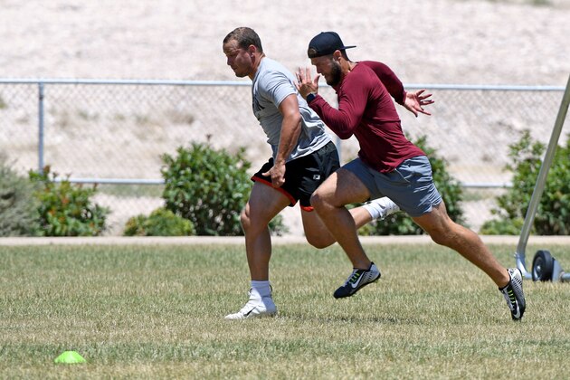 LAS VEGAS, NEVADA - JUNE 17:  Fullback Alec Ingold (L) and safety Erik Harris of the Las Vegas Raiders work out in a park on June 17, 2020 in Las Vegas, Nevada. Training camp for all NFL teams is scheduled to start on July 28, depending on complications from the coronavirus pandemic. The Raiders plan on hosting their camp in the team's Headquarters/Intermountain Healthcare Performance Center that is nearing completion in Henderson, Nevada, this summer, instead of in Napa, California, amid the continuing spread of COVID-19.  (Photo by Ethan Miller/Getty Images)