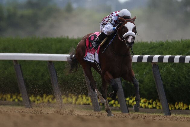 ELMONT, NEW YORK - JUNE 20: Tiz the Law #8, ridden by jockey Manuel Franco leads the field to the finish line to win the 152nd running of the Belmont Stakes at Belmont Park on June 20, 2020 in Elmont, New York. (Photo by Al Bello/Getty Images)