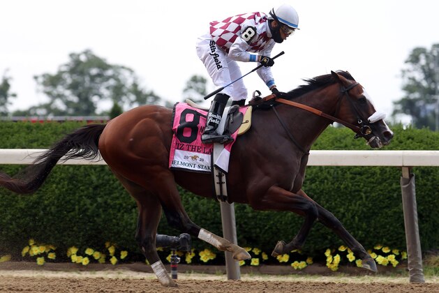 ELMONT, NEW YORK - JUNE 20: Jockey Manuel Franco celebrates atop Tiz the Law #8 after crossing the finish line to win the 152nd running of the Belmont Stakes at Belmont Park on June 20, 2020 in Elmont, New York. (Photo by Al Bello/Getty Images)