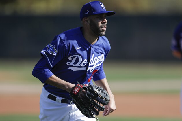 Los Angeles Dodgers pitcher David Price runs during spring training baseball Friday, Feb. 14, 2020, in Phoenix. (AP Photo/Gregory Bull)