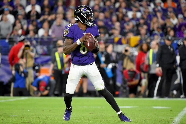 BALTIMORE, MARYLAND - JANUARY 11: Lamar Jackson #8 of the Baltimore Ravens looks to pass against the Tennessee Titans during the AFC Divisional Playoff game at M&T Bank Stadium on January 11, 2020 in Baltimore, Maryland. (Photo by Will Newton/Getty Images)