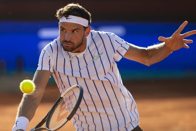 BELGRADE, SERBIA - JUNE 14: Grigor Dimitrov of Bulgaria returns during his match against Dominic Thiem of Austria during the day 3 of the Adria Tour exhibition tournament on June 14, 2020 in Belgrade, Serbia. (Photo by Nikola Krstic/MB Media/Getty Images)