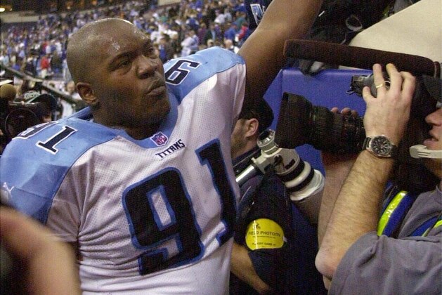 Tennessee Titans Josh Evans shakes hands with fans after their 19-16 win over the Indianapolis Colts during the AFC divisional playoff game on 16 January 2000.  The Titans will face the Jacksonville Jaguars next Sunday. AFP PHOTO by Jeff KOWALSKY (Photo by JEFF KOWALSKY / AFP) (Photo by JEFF KOWALSKY/AFP via Getty Images)