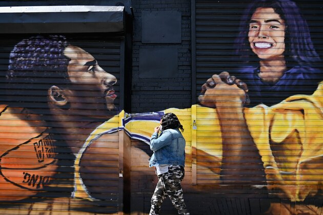 A woman with a face mask walks past a Kobe Bryant and Gianna Bryant mural on June 1, 2020 in the Brooklyn borough of New York City. (Photo by Angela Weiss / AFP) (Photo by ANGELA WEISS/AFP via Getty Images) A woman with a face mask walks past a Kobe Bryant and Gianna Bryant mural on June 1, 2020 in the Brooklyn borough of New York City. (Photo by Angela Weiss / AFP) (Photo by ANGELA WEISS/AFP via Getty Images)