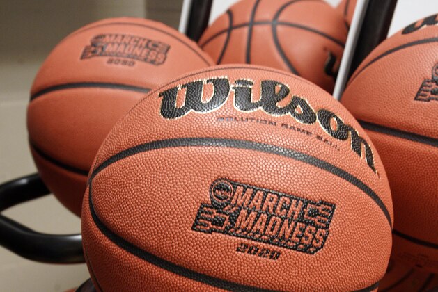 Official March Madness 2020 tournament basketballs are seen in a store room at the CHI Health Center Arena, in Omaha, Neb., Monday, March 16, 2020. Omaha was to host a first and second round in the NCAA college basketball Division I tournament, which was cancelled due to the coronavirus pandemic. (AP Photo/Nati Harnik)