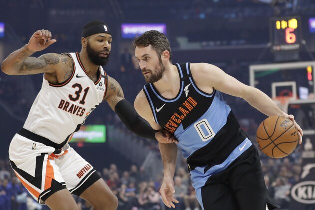 Cleveland Cavaliers' Kevin Love (0) drives past Los Angeles Clippers' Marcus Morris Sr. (31) in the first half of an NBA basketball game, Sunday, Feb. 9, 2020, in Cleveland. (AP Photo/Tony Dejak)