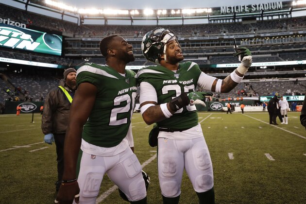 New York Jets free safety Marcus Maye (20) and Jamal Adams (33) pose for photographs after an NFL football game against the Oakland Raiders Sunday, Nov. 24, 2019, in East Rutherford, N.J. The Jets won 34-3. (AP Photo/Adam Hunger)