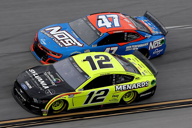 TALLADEGA, ALABAMA - JUNE 22:  Ryan Blaney, driver of the #12 Menards/Sylvania Ford, races Ricky Stenhouse Jr., driver of the #47 NOS Energy Drink Chevrolet, during the NASCAR Cup Series GEICO 500 at Talladega Superspeedway on June 22, 2020 in Talladega, Alabama. (Photo by Chris Graythen/Getty Images)