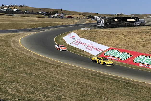 Daniel Hemric (8) and William Byron (24) drive into