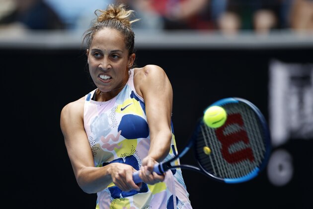 Madison Keys of the U.S. returns a backhand return to Greece's Maria Sakkari in their third round singles match at the Australian Open tennis championship in Melbourne, Australia, Friday, Jan. 24, 2020. (AP Photo/Andy Wong)
