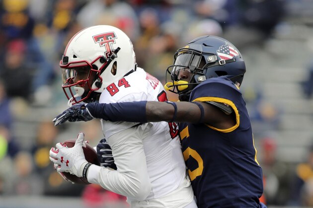 Texas Tech's Erik Ezukanma (84) catches a ball as West Virginia's Kerry Martin Jr. (15) defends during the third quarter of their NCAA college football game in Morgantown, W.Va., Saturday, Nov. 9, 2019. (AP Photo/Chris Jackson) Texas Tech's Erik Ezukanma (84) catches a ball as West Virginia's Kerry Martin Jr. (15) defends during the third quarter of their NCAA college football game in Morgantown, W.Va., Saturday, Nov. 9, 2019. (AP Photo/Chris Jackson)