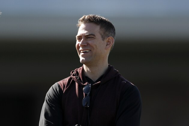 Chicago Cubs president of baseball operations Theo Epstein looks on during a spring training baseball workout Wednesday, Feb. 12, 2020, in Mesa, Ariz. (AP Photo/Gregory Bull)