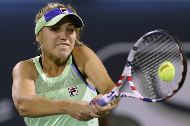 FILE - In this Feb. 18, 2020, file photo, Sofia Kenin returns the ball to Kazakhstan's Elena Rybakina during a match of the Dubai Duty Free Tennis Championship in Dubai, United Arab Emirates. If World TeamTennis gets its way, Grand Slam champions Sofia Kenin and Sloane Stephens could be among the first tennis players to compete in front of fans after the coronavirus pandemic prompted lockdowns around the globe. WTT said Tuesday, May 26, 2020, it is planning to allow up to 500 spectators at each of its outdoor matches during a three-week season from July 12 to Aug. 2 at a resort in West Virginia.(AP Photo/Kamran Jebreili, File)