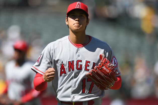 OAKLAND, CA - APRIL 01:  Shohei Ohtani #17 of the Los Angeles Angels of Anaheim walks off the mound and reacts after striking out Marcus Semien #10 of the Oakland Athletics for the final out of the fifth inning of a Major League baseball game at Oakland Alameda Coliseum on April 1, 2018 in Oakland, California.  (Photo by Thearon W. Henderson/Getty Images)