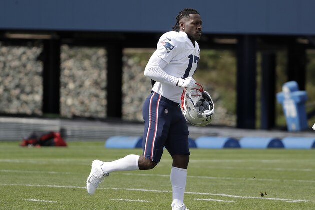 New England Patriots wide receiver Antonio Brown carries his helmet during an NFL football practice, Wednesday, Sept. 18, 2019, in Foxborough, Mass. (AP Photo/Steven Senne)