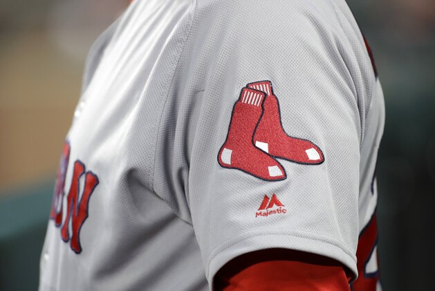 The Boston Red Sox logo is seen on first base coach Ruben Amaro Jr's jersey during a baseball game against the Baltimore Orioles in Baltimore, Saturday, April 22, 2017. (AP Photo/Patrick Semansky)
