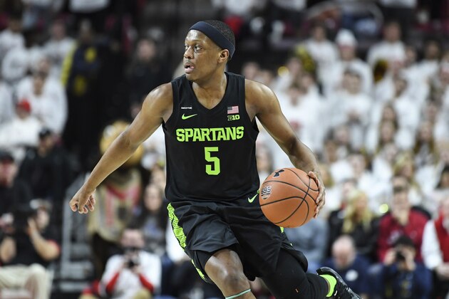 Michigan State guard Cassius Winston (5) brings the ball up court during the second half of an NCAA college basketball game against Maryland Saturday, February 29, 2020, in College Park, Md. (AP Photo/Terrance Williams)