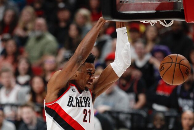 Portland Trail Blazers center Hassan Whiteside dunks against the Sacramento Kings during the second half of an NBA basketball game in Portland, Ore., Saturday, March 7, 2020. Sacramento won 123-111. (AP Photo/Steve Dipaola)